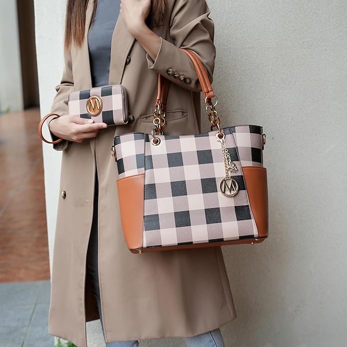 Elegant beige leather handbag with gold hardware on a marble surface